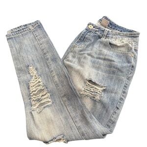 Woman’s tapered leg, distressed jeans.
